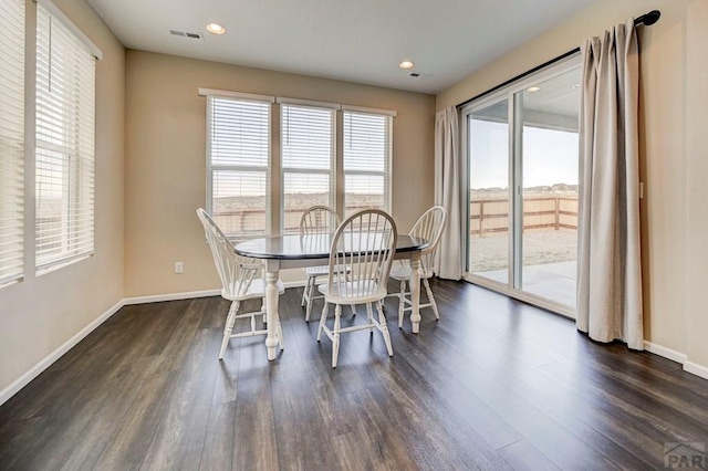 dining room with dark wood-style flooring, recessed lighting, visible vents, and baseboards