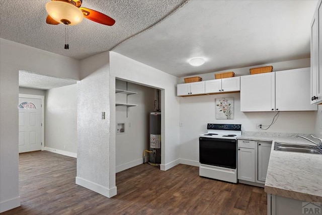 kitchen featuring gas water heater, white electric range, a sink, white cabinets, and light countertops