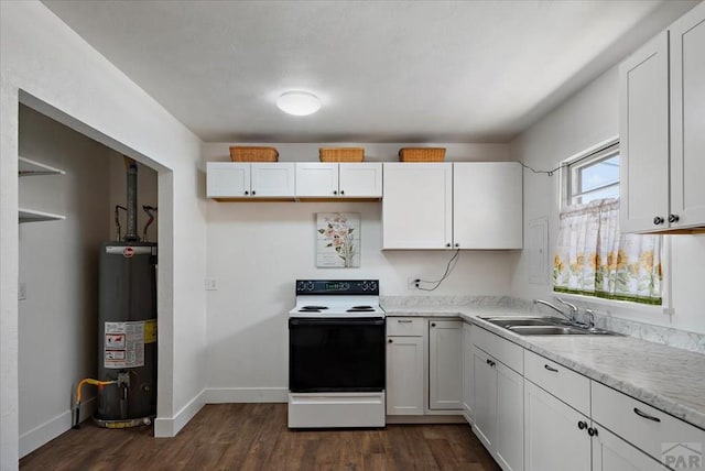 kitchen featuring gas water heater, white cabinets, range with electric stovetop, and a sink