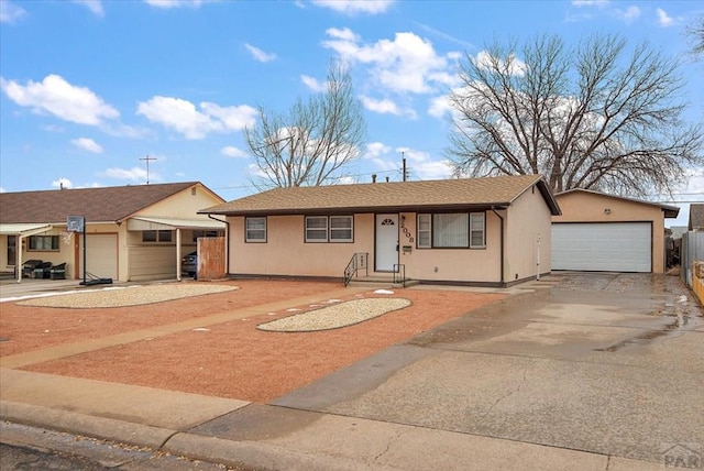 ranch-style house featuring stucco siding