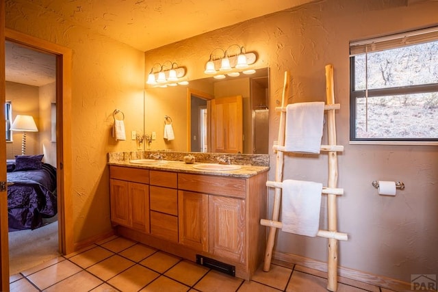 109 County Rd 405, Cuchara, CO 81055 - full bathroom featuring a textured wall, tile patterned floors, ensuite bath, and double vanity