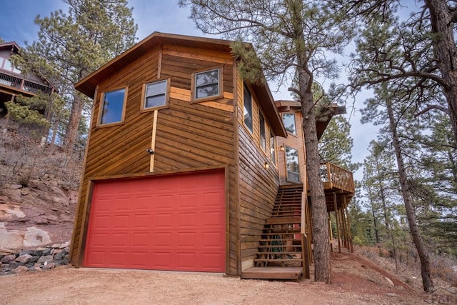 109 County Rd 405, Cuchara, CO 81055 - view of front of home featuring a garage, stairway, and a deck