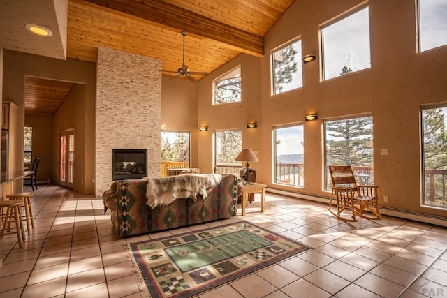 109 County Rd 405, Cuchara, CO 81055 - tiled living room featuring wooden ceiling, healthy amount of natural light, high vaulted ceiling, beam ceiling, and ceiling fan