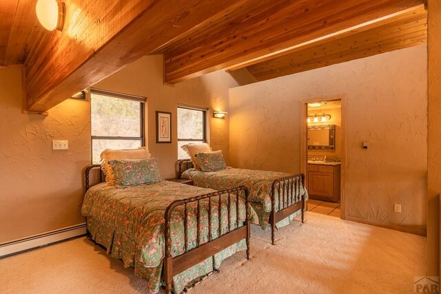 109 County Rd 405, Cuchara, CO 81055 - bedroom with carpet, wooden ceiling, a textured wall, a baseboard radiator, and ensuite bath