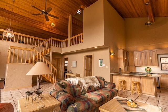 109 County Rd 405, Cuchara, CO 81055 - living room with wooden ceiling, light tile patterned floors, high vaulted ceiling, stairs, and a ceiling fan