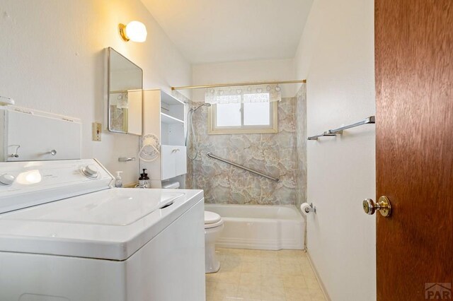 full bathroom featuring toilet, washer / dryer, tub / shower combination, and vanity