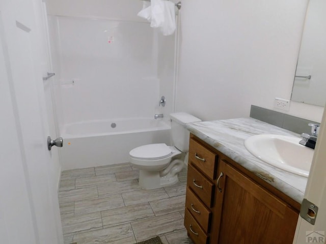 full bath featuring shower / washtub combination, vanity, and toilet