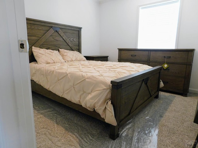 bedroom featuring light colored carpet