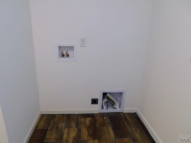 washroom with washer hookup, dark wood finished floors, electric dryer hookup, laundry area, and baseboards