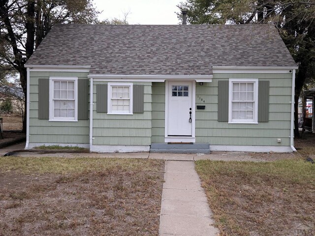 view of front facade with a shingled roof