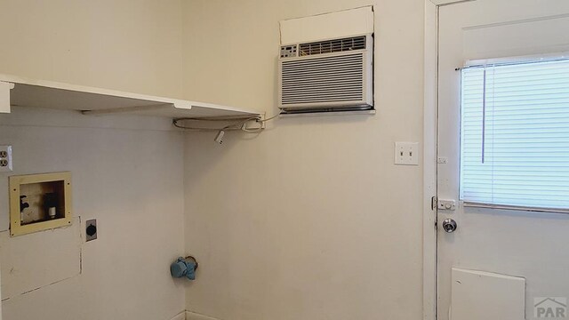 laundry room with washer hookup, laundry area, hookup for an electric dryer, and an AC wall unit