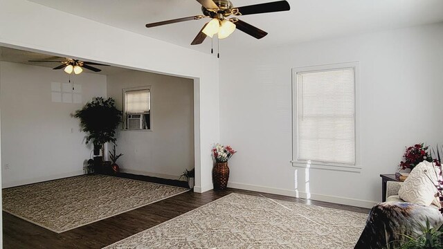 interior space featuring baseboards and dark wood-style flooring