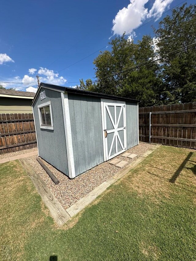 view of shed featuring a fenced backyard