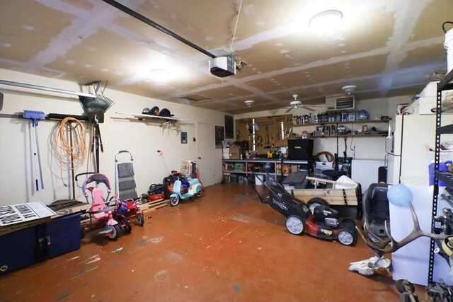 garage featuring a workshop area and a garage door opener