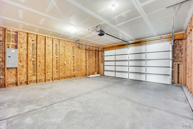 garage featuring a garage door opener and electric panel