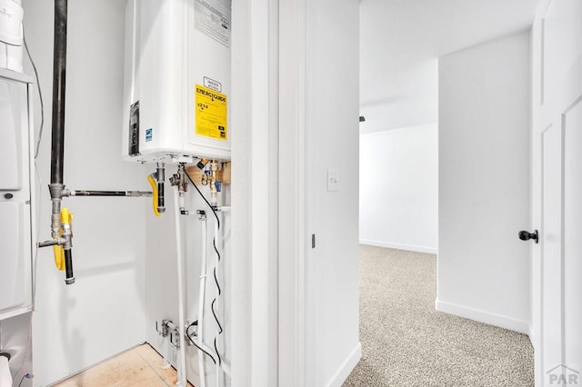 utility room featuring water heater