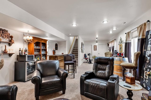 living room with stairway, light carpet, a bar, and visible vents