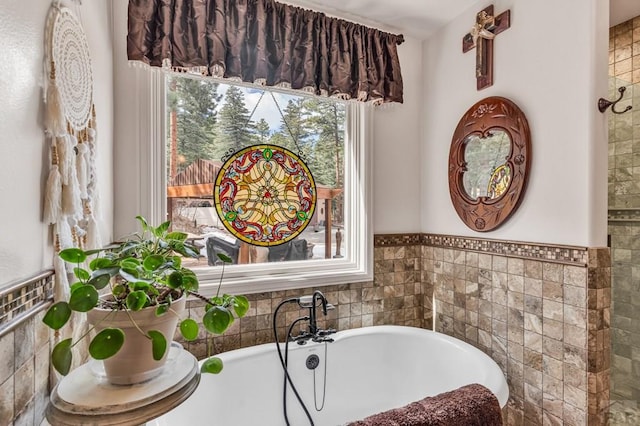 bathroom with a soaking tub