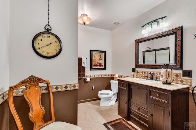 bathroom featuring visible vents, toilet, decorative backsplash, tile patterned floors, and vanity