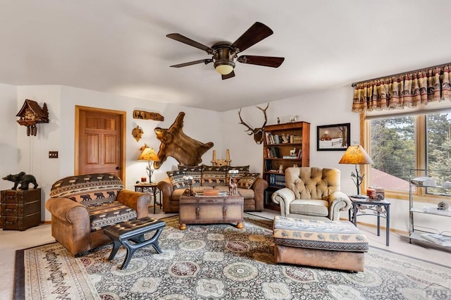 carpeted living room featuring a ceiling fan