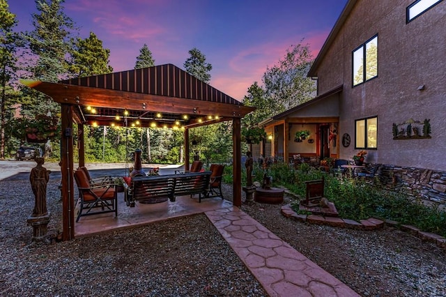 yard at dusk with a patio and an outdoor living space