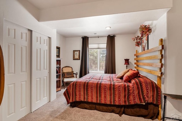 bedroom with a closet and carpet floors