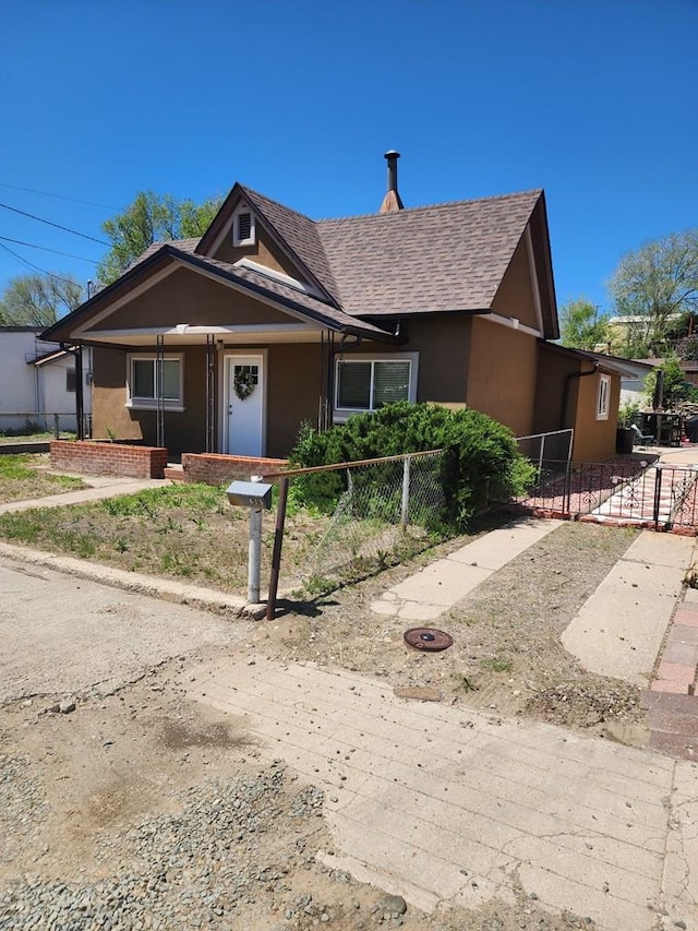 615 San Juan St, Trinidad, CO 81082 - view of front of home with a shingled roof and stucco siding
