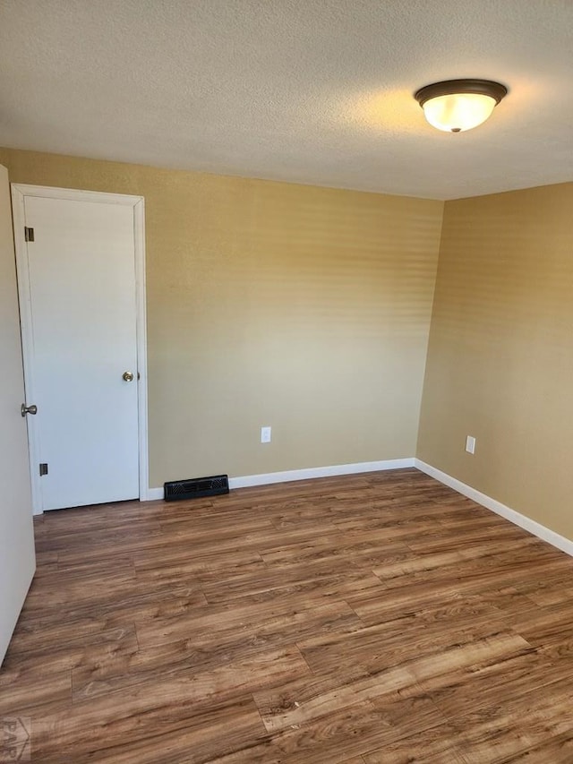 615 San Juan St, Trinidad, CO 81082 - unfurnished room featuring wood finished floors and baseboards