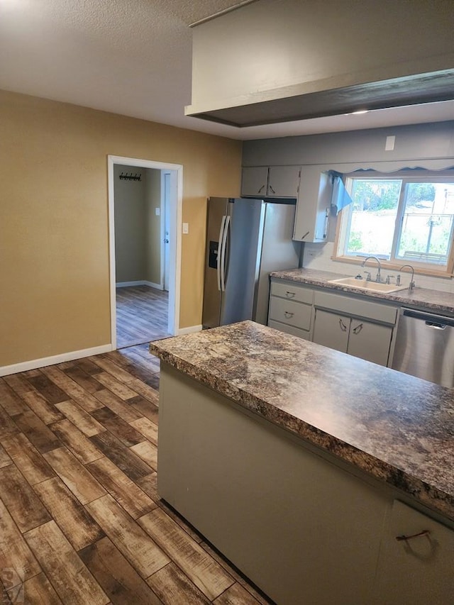 615 San Juan St, Trinidad, CO 81082 - kitchen with stainless steel appliances and dark wood finished floors