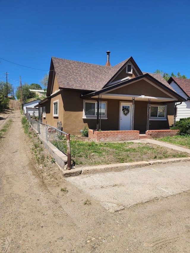 615 San Juan St, Trinidad, CO 81082 - bungalow-style home with roof with shingles and stucco siding