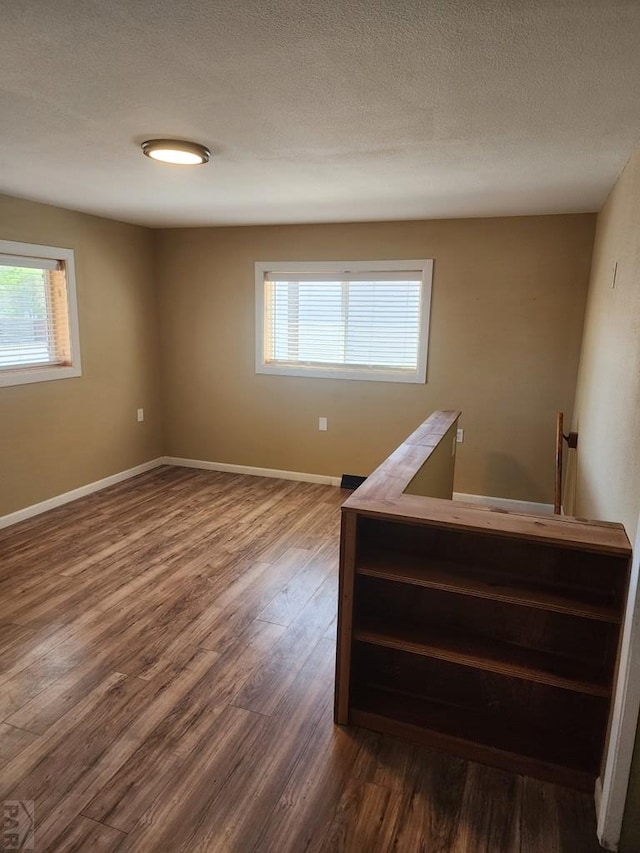 615 San Juan St, Trinidad, CO 81082 - unfurnished room featuring dark wood-type flooring and plenty of natural light