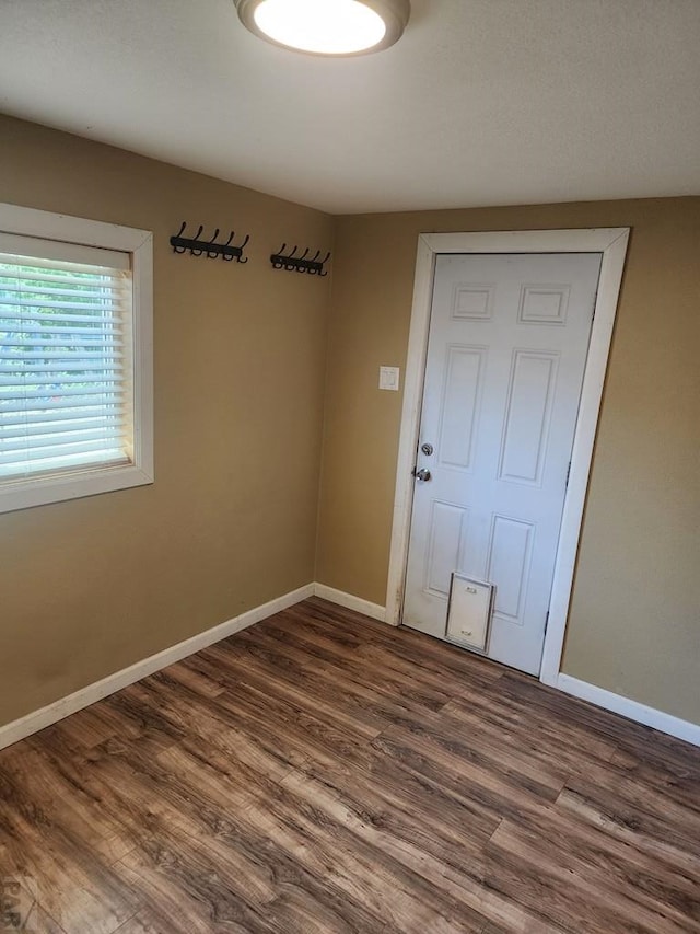 615 San Juan St, Trinidad, CO 81082 - empty room with baseboards and dark wood finished floors
