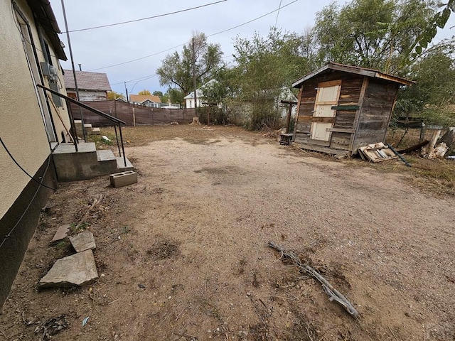 308 W Poplar St, Lamar, CO 81052 - view of yard featuring an outbuilding and a fenced backyard