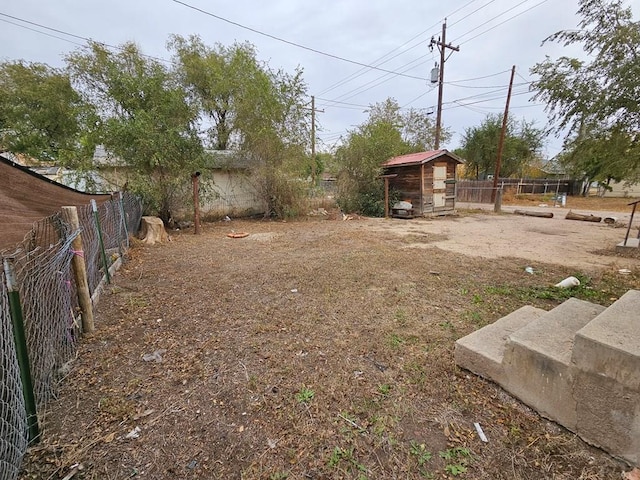 308 W Poplar St, Lamar, CO 81052 - view of yard with fence and an outdoor structure