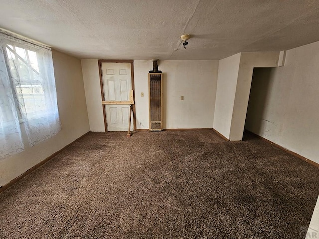 308 W Poplar St, Lamar, CO 81052 - carpeted empty room with a textured ceiling
