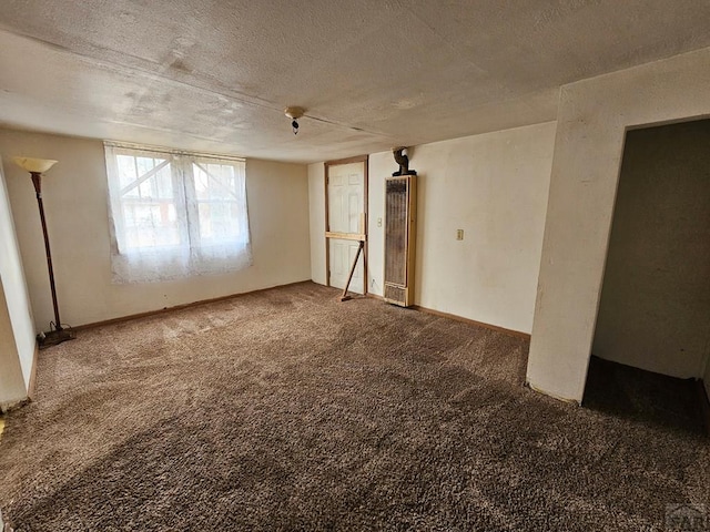 308 W Poplar St, Lamar, CO 81052 - spare room with a textured ceiling and carpet flooring