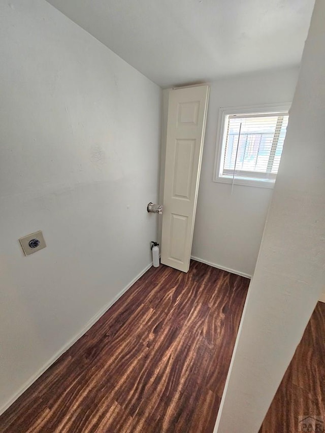 1337 Spruce St, Pueblo, CO 81004 - spare room with baseboards and dark wood-style flooring