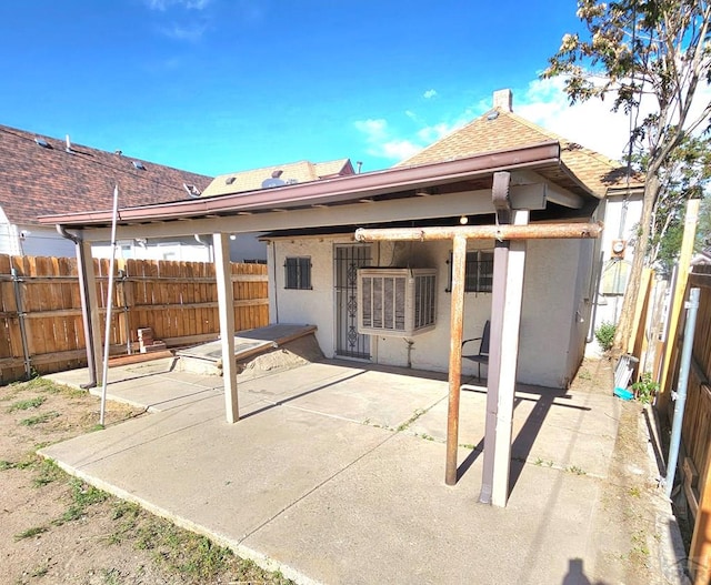 1337 Spruce St, Pueblo, CO 81004 - back of property featuring a patio area, stucco siding, and roof with shingles