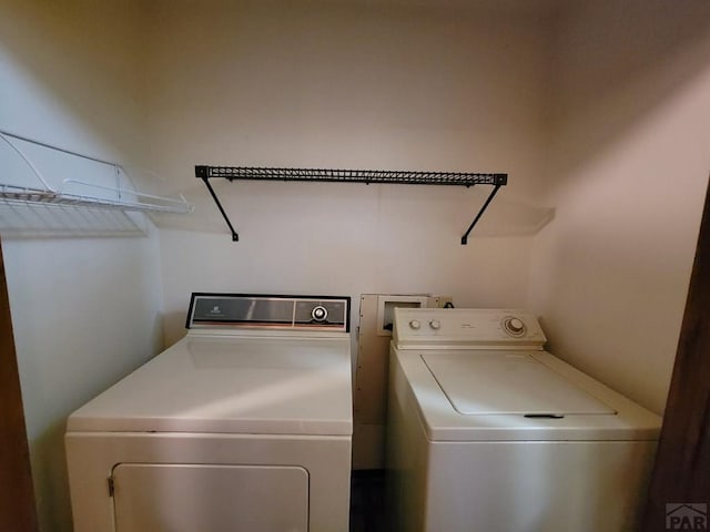 washroom with laundry area and washing machine and clothes dryer