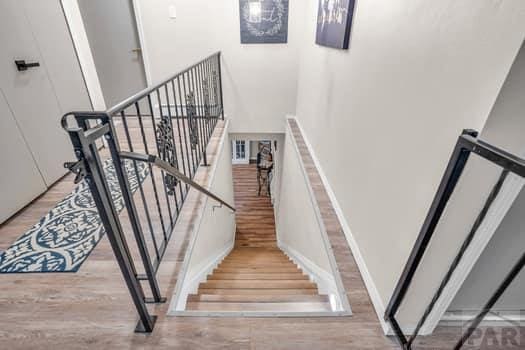 stairs with wood finished floors