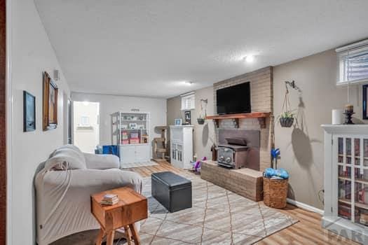 living area with wood finished floors and baseboards