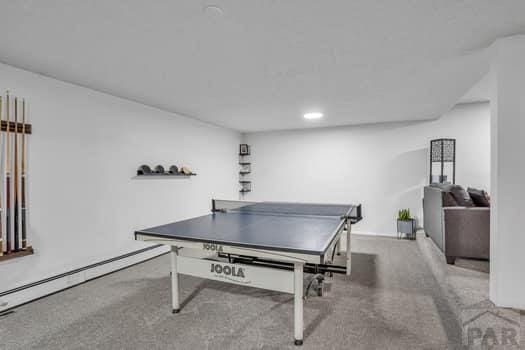 game room featuring carpet, baseboard heating, and recessed lighting