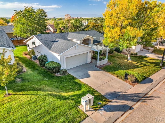 view of front facade with a shingled roof, a front lawn, a pergola, and stucco siding