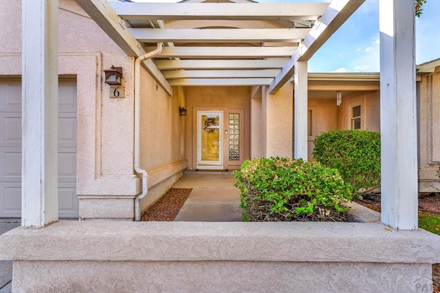 entrance to property with stucco siding