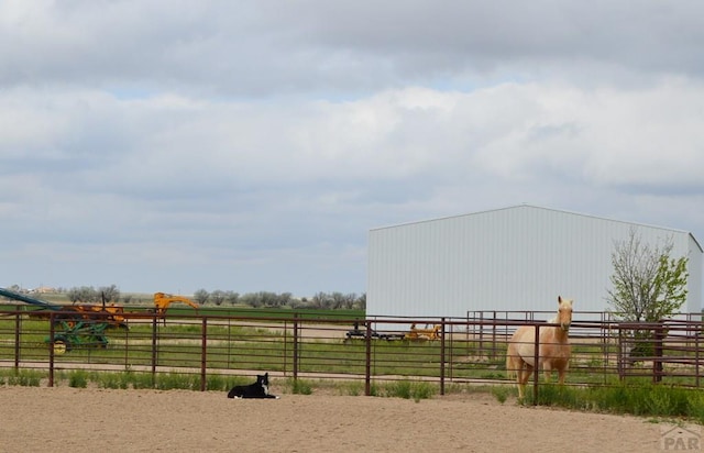 22661 Rd 24, La Junta, CO 81050 - view of yard featuring a pole building, fence, an outbuilding, and a rural view