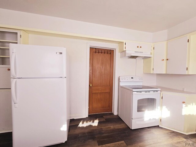 kitchen featuring under cabinet range hood, white appliances, white cabinetry, light countertops, and dark wood-style floors