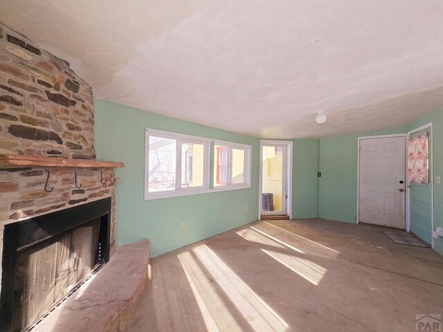 unfurnished living room featuring a fireplace