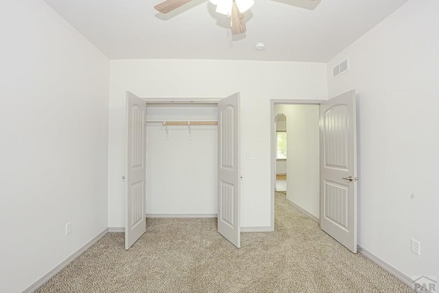 2221 Cliffmoor Ln, Pueblo, CO 81008 - unfurnished bedroom with light carpet, a closet, baseboards, and ceiling fan