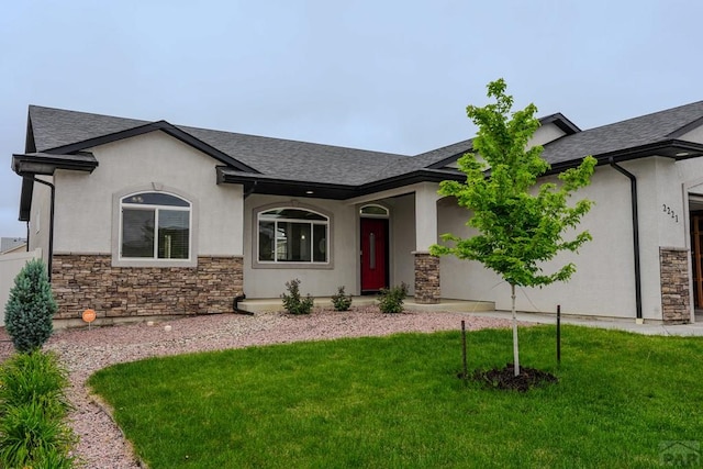 2221 Cliffmoor Ln, Pueblo, CO 81008 - ranch-style house with stone siding, stucco siding, a front yard, and roof with shingles