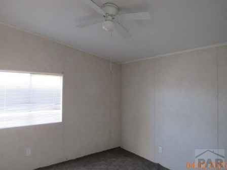 326 Katherine St, Avondale, CO 81022 - spare room featuring ceiling fan